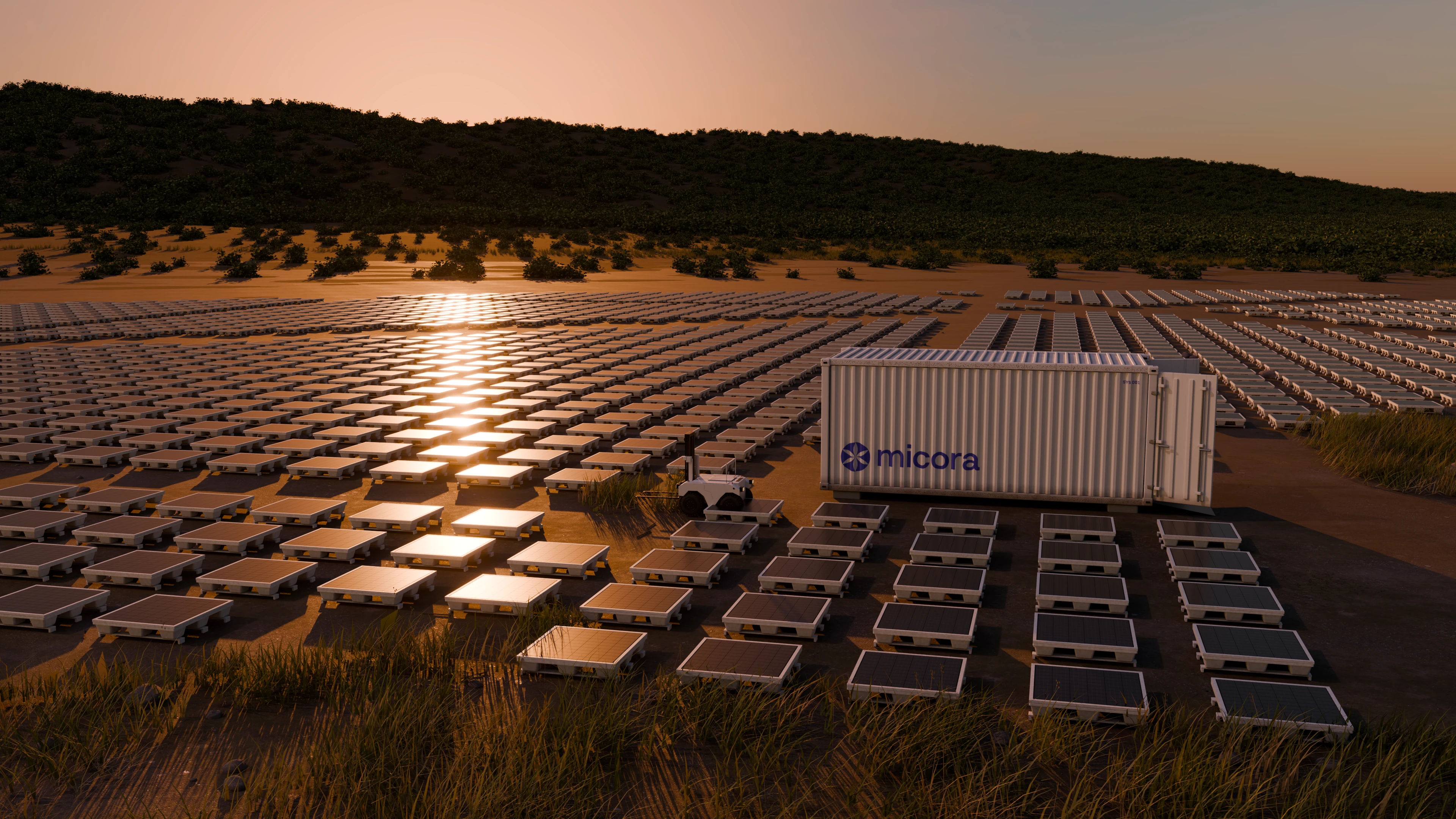 Solar Blocks and a Micora Core container deployed in a field at sunset